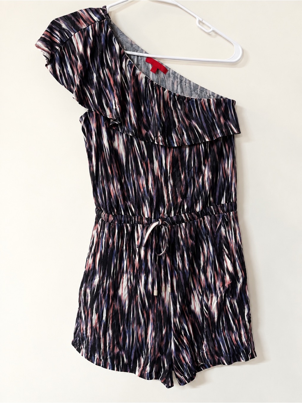 Jennifer Lopez One-Shoulder Printed Romper in Navy, Pink, Cream